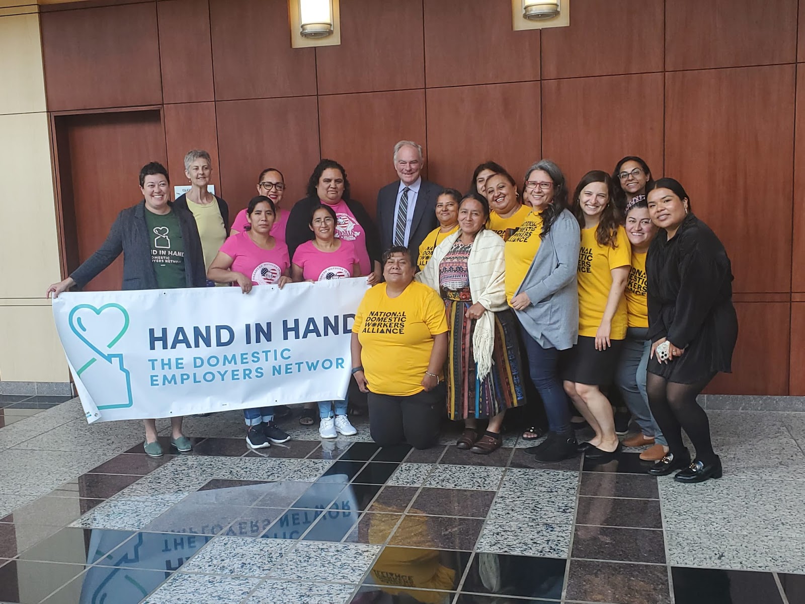 NDWA members taking photo with Senator Tim Kaine